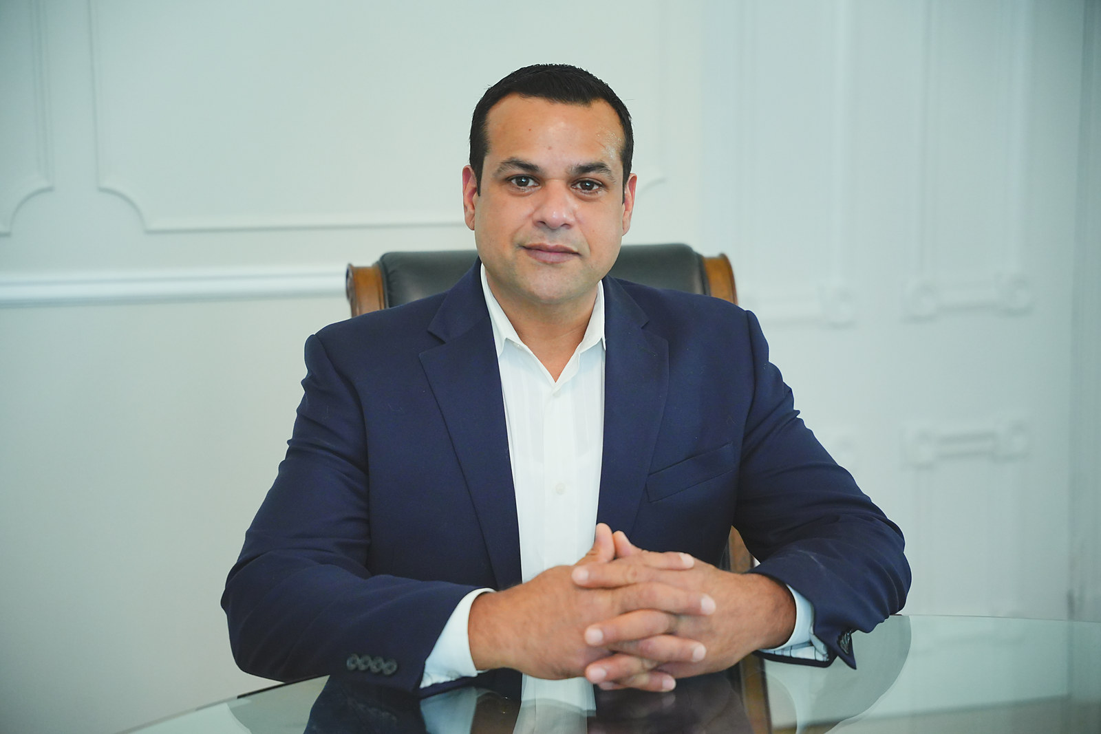 Paul Tarriwal seated at his desk.